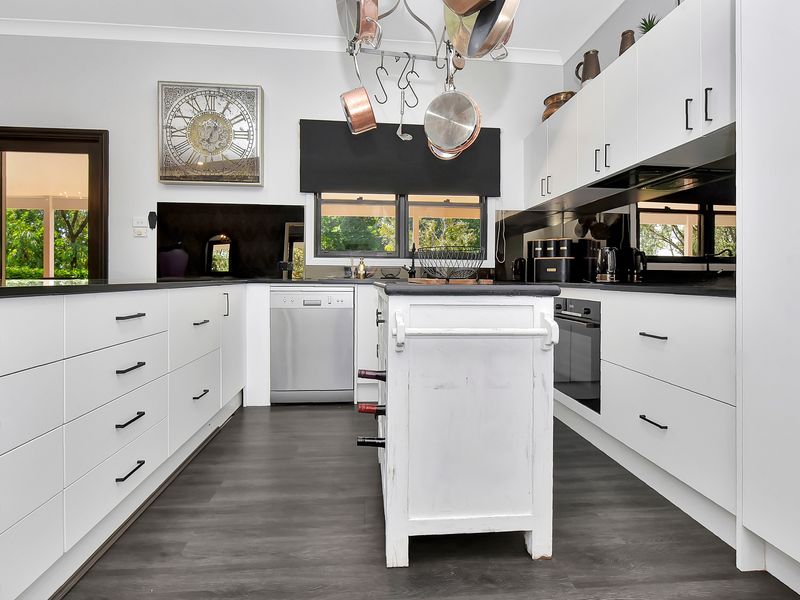 Bright kitchen with generous storage and stylish fittings.