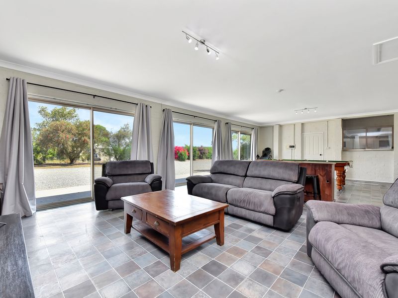 Open living area with plenty of natural light and cozy seating