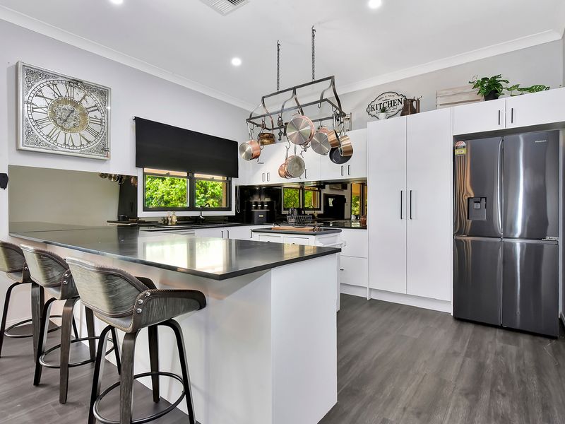 Contemporary island kitchen ideal for shared meals and entertaining.