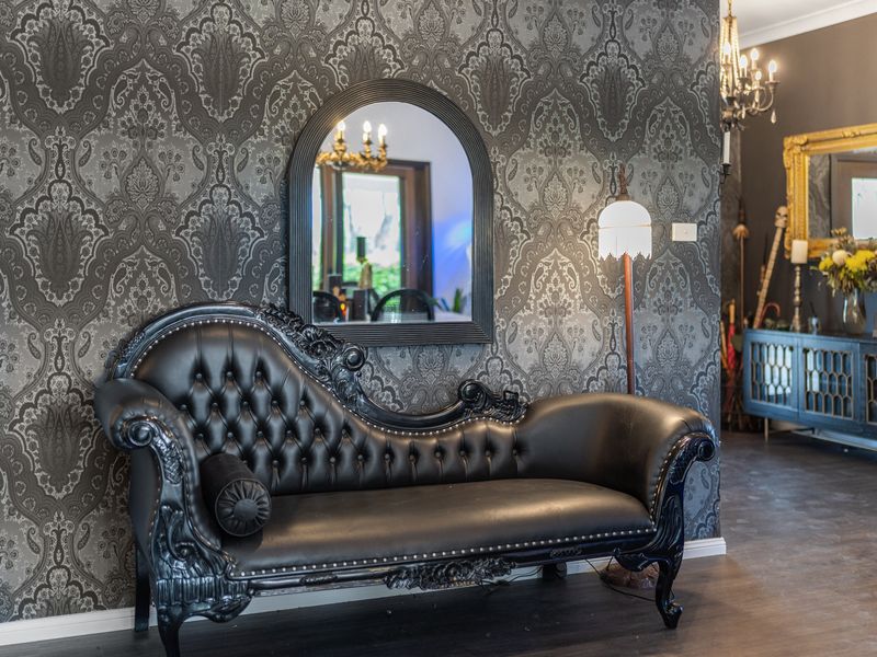 Elegant lounge corner with vintage charm and cozy seating.