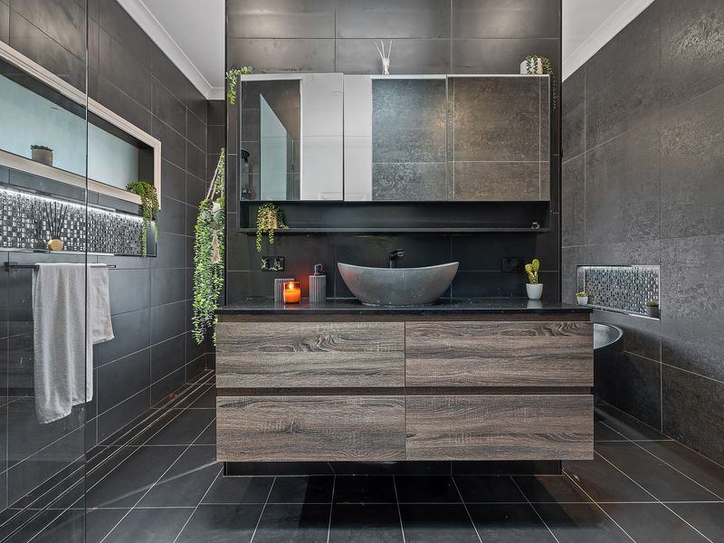 Contemporary vanity with warm lighting and premium fixtures.