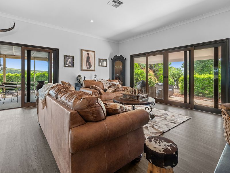 Sunlit lounge framed by wide sliding doors to the garden.