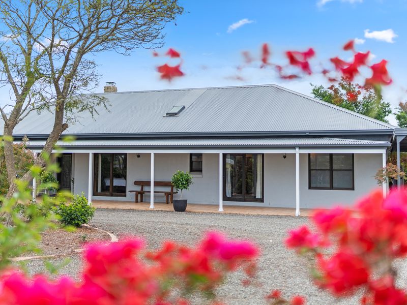 Front façade showcasing a charming, peaceful country-style home