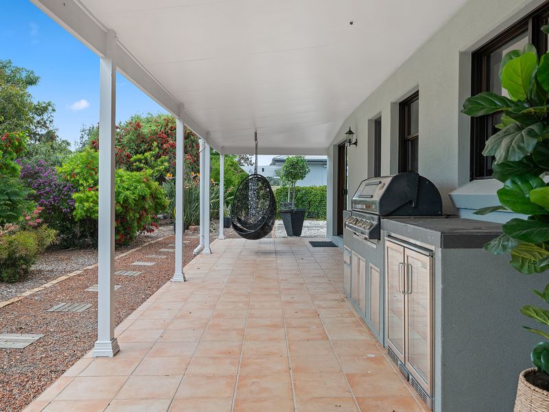Spacious covered walkway connecting outdoor entertaining spaces