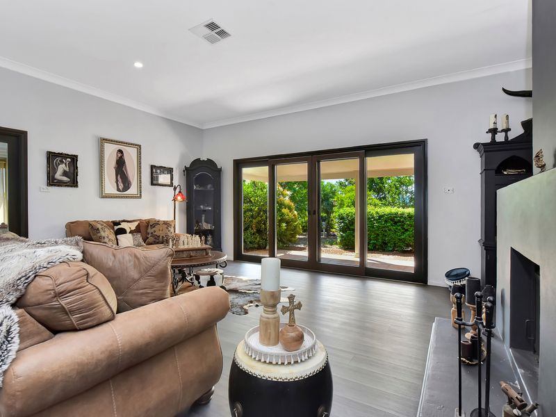 Spacious living area with soft, earthy tones.