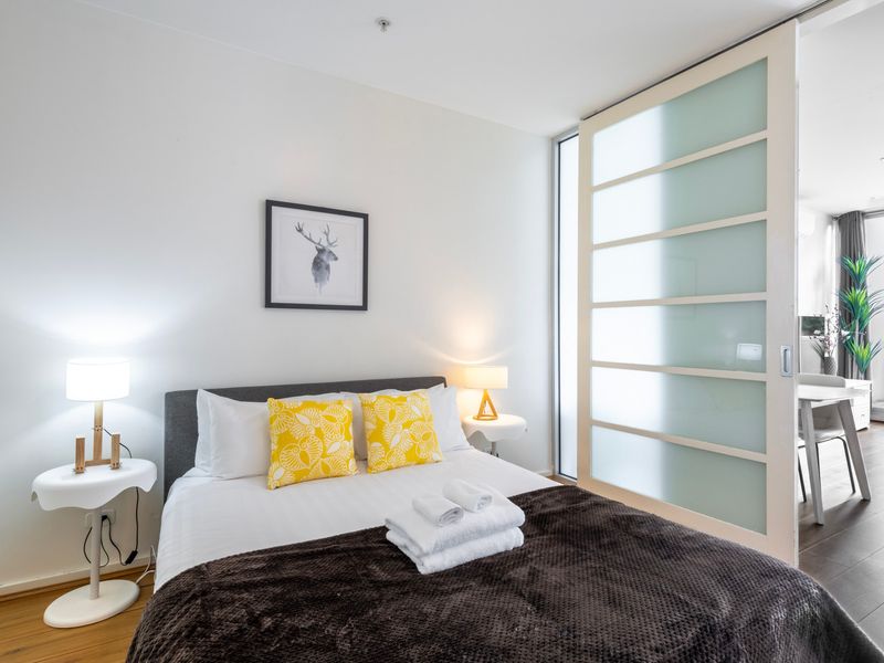 Comfortable bedroom with plush bedding