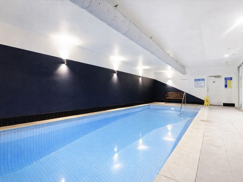 Inviting indoor lap pool perfect for a refreshing swim or relaxing unwind.