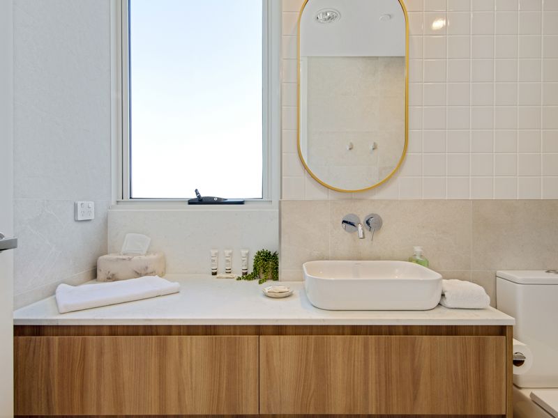 Modern bathroom with sleek vanity and fresh towels