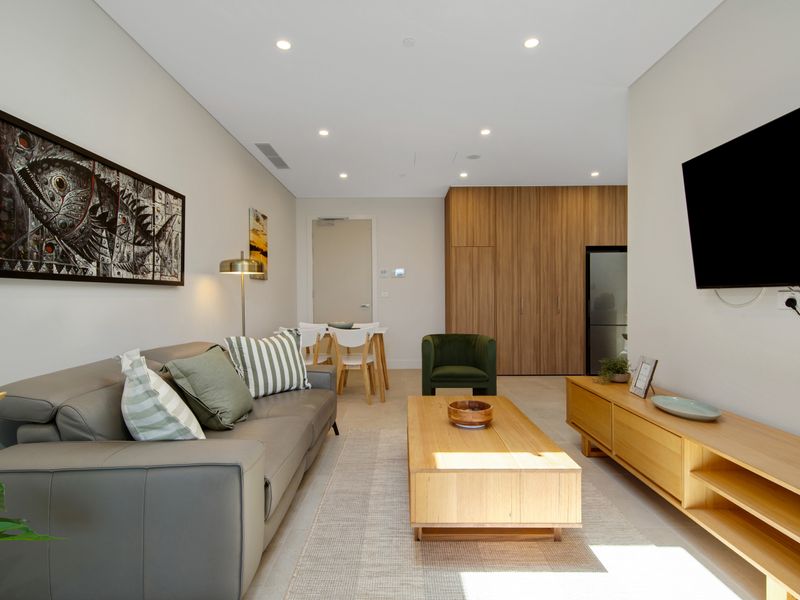 Relaxing lounge space with smart TV and natural light