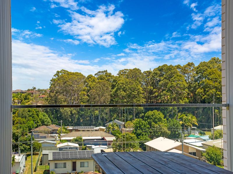 Elevated outlook across treetops and nearby homes