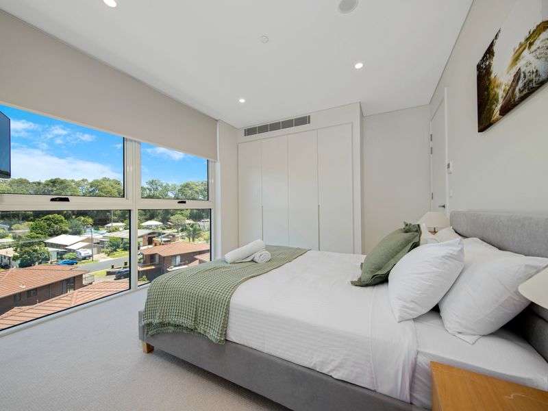Bedroom with large windows and peaceful outlook