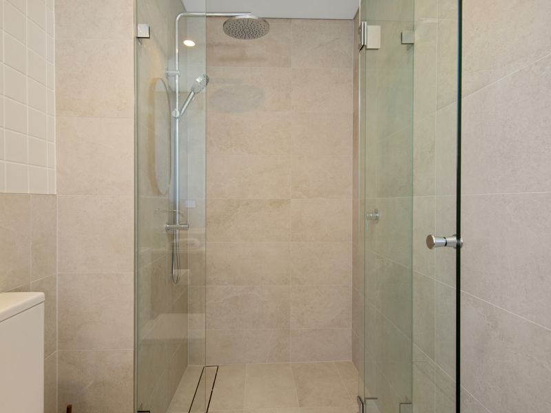 Modern bathroom with walk-in shower and clean finishes