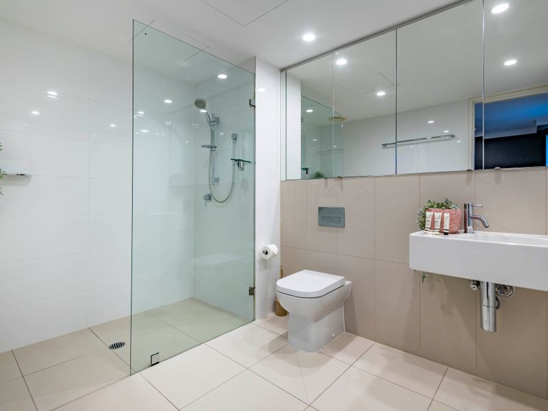 Sleek bathroom with walk-in shower and quality fittings