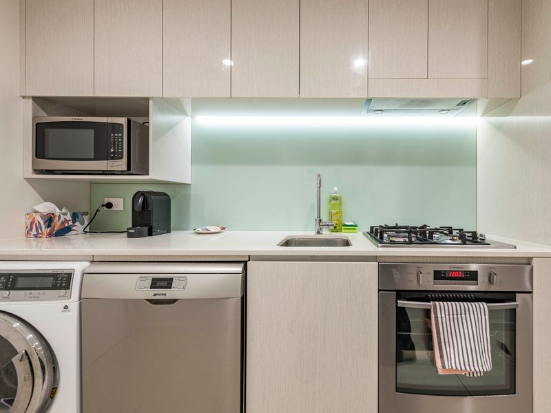 Fully equipped kitchen with modern appliances and ample bench space