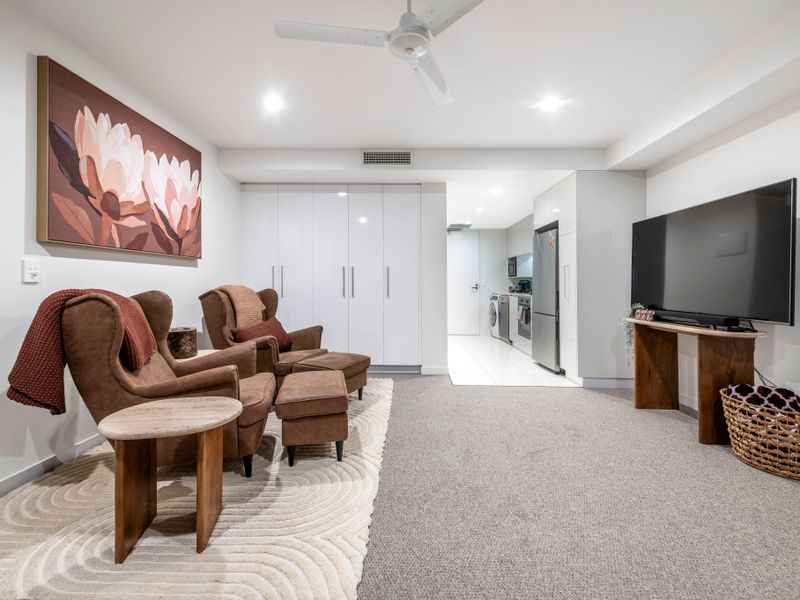 Spacious lounge with TV, soft furnishings, and relaxed layout