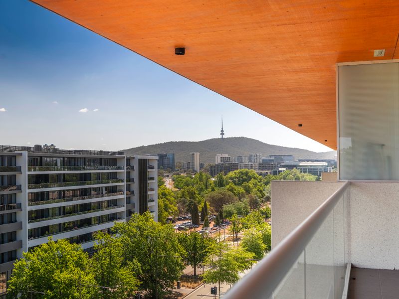 Elevated outlook across modern buildings and green surrounds