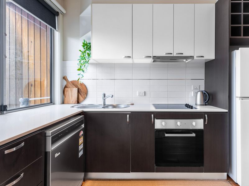 A sleek, well-appointed kitchen designed for easy meals and everyday comfort