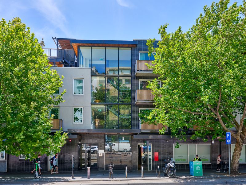 Contemporary building exterior surrounded by leafy greenery