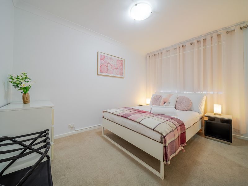 Light-filled bedroom styled for rest and comfort