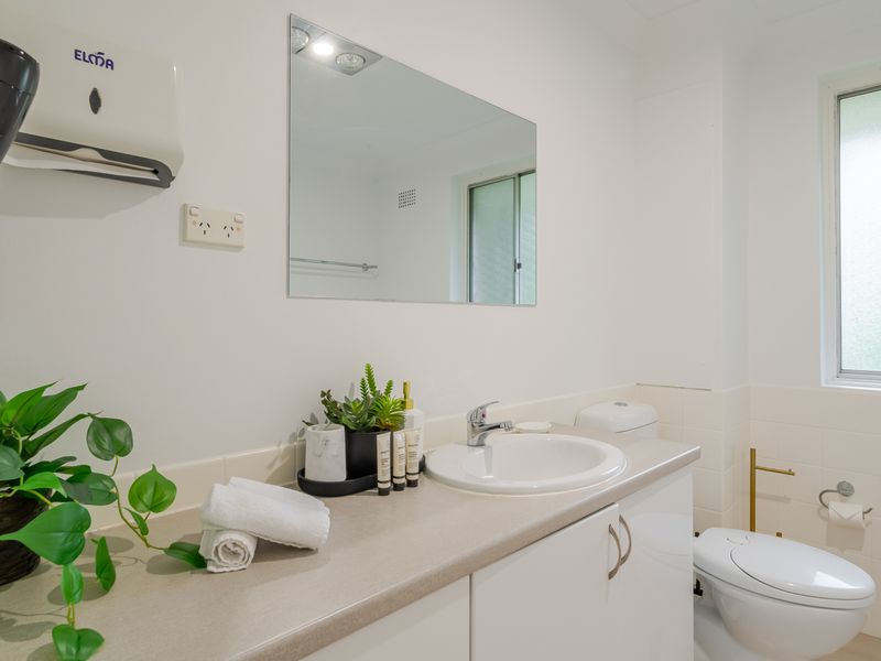 Clean bathroom with fresh towels and essentials