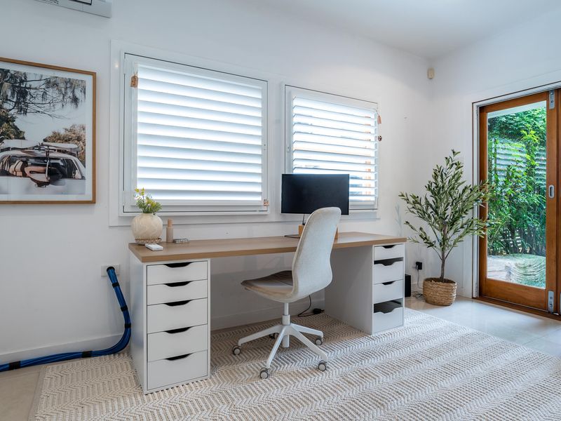 The property features a bright and spacious dedicated workspace, perfect for those needing a productive environment during their stay.