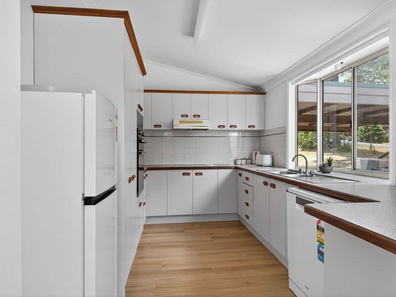 Bright, fully equipped kitchen with modern appliances