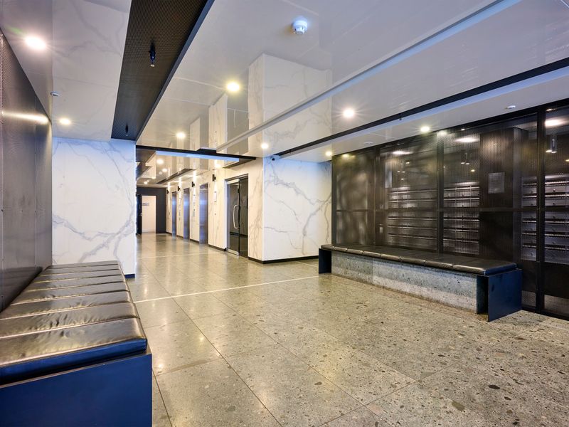 Secure building entrance with well-maintained common areas