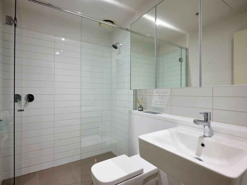 Sleek bathroom with walk-in shower and contemporary finishes