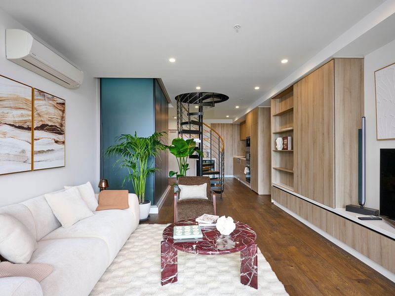 Bright, modern living area with designer furnishings