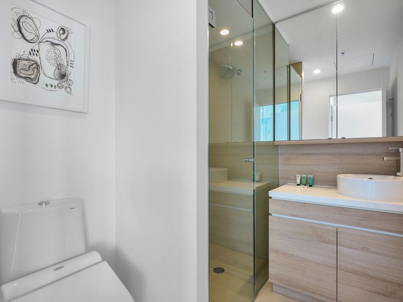 Sleek bathroom with walk-in shower and modern finishes