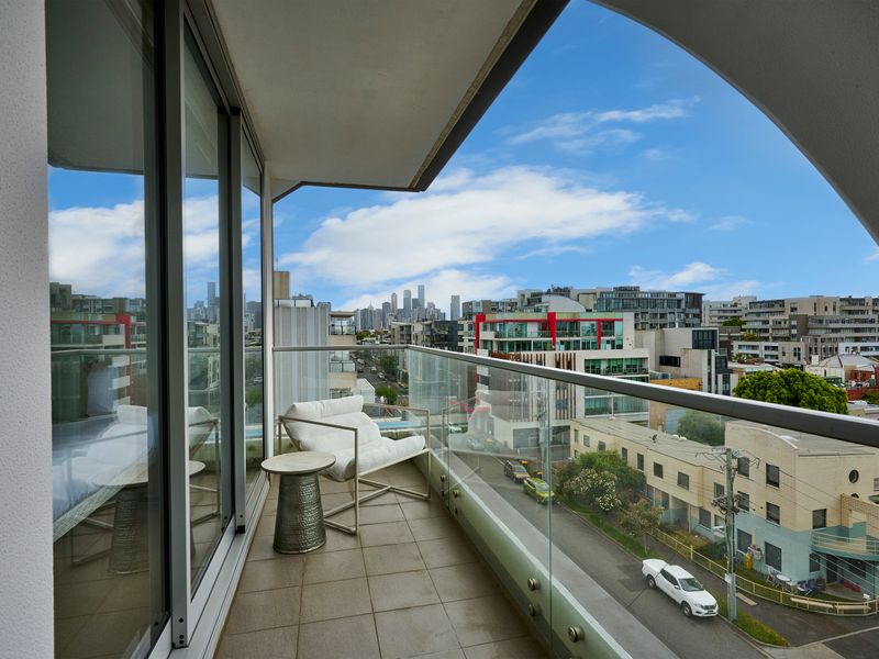 Private balcony overlooking vibrant inner-city scenery