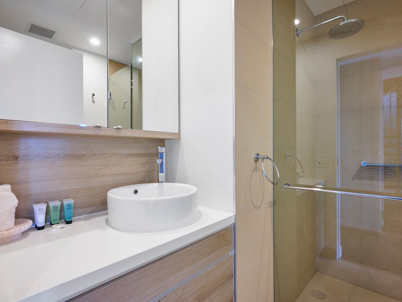 Modern bathroom with walk-in shower and sleek finishes