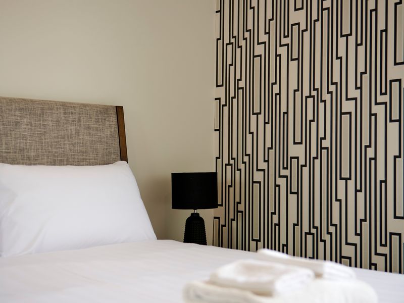 Inviting bedroom with crisp linens and modern design