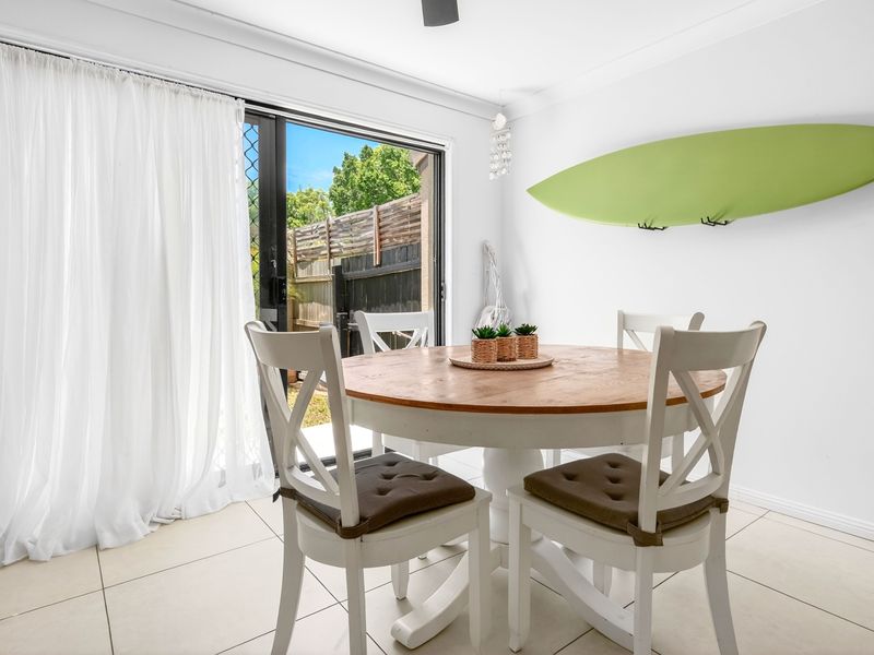Sunlit dining area with garden outlook