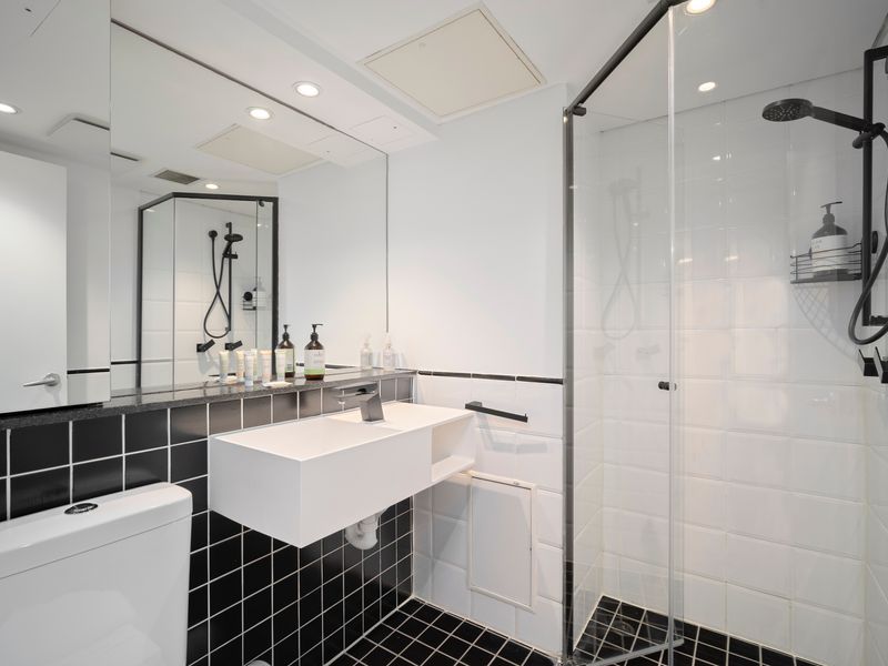 Sleek modern bathroom with walk-in shower and contemporary finishes.