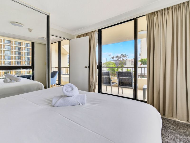 Comfortable bedroom with balcony access