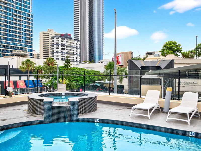 Pool area with skyline views