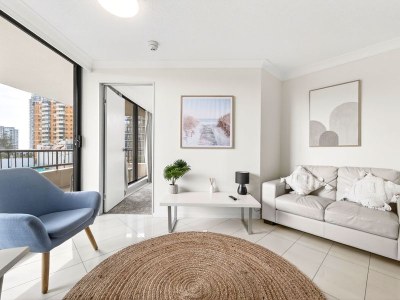 Bright open-plan living space with balcony access