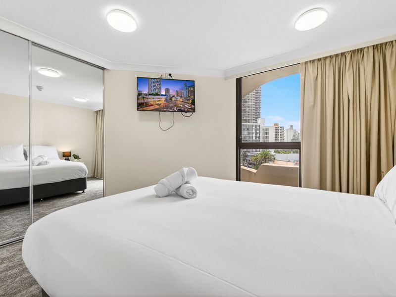 Serene sleeping space with mirrored wardrobe