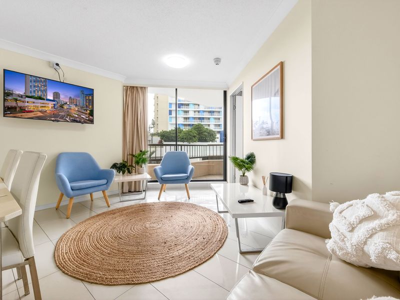 Bright and cozy living area with city outlook