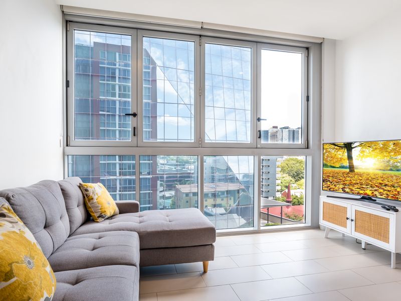 Bright living area with city views and plenty of natural light