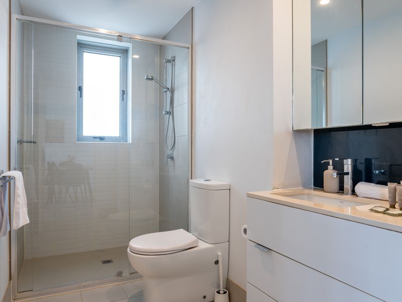 Modern bathroom with walk-in shower and premium finishes