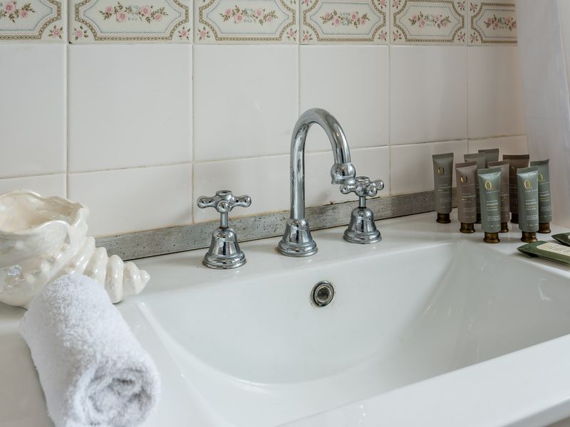 Clean bathroom vanity with toiletries