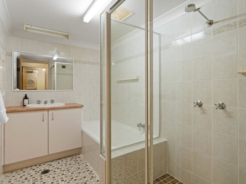 Clean and spacious bathroom with shower and vanity