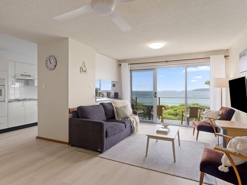 Open-plan living space filled with natural light and views