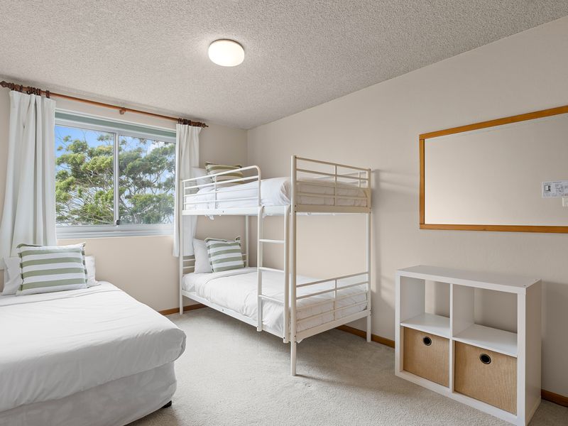 Family-friendly bedroom with bunk beds and natural light