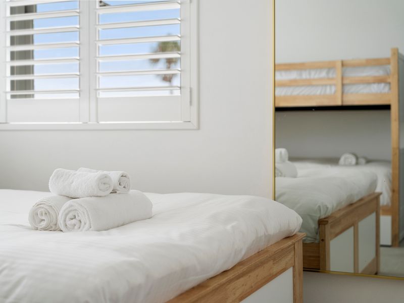 Cozy bunk room with fresh linens