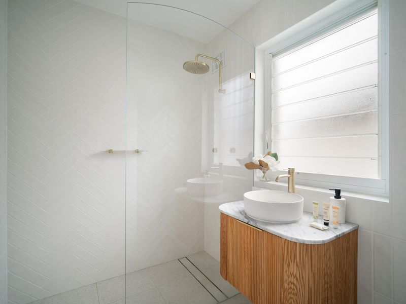 Clean modern bathroom with walk in shower