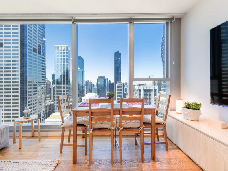 Bright dining space overlooking the city skyline
