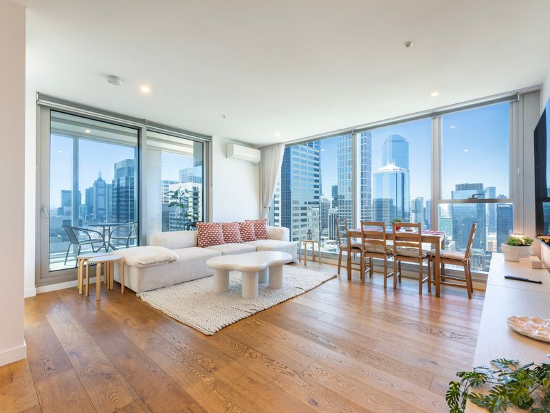 Sun-filled open-plan living and dining with stunning city views